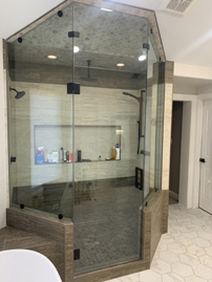 Tub enclosure glass by Bay Glass & Shower